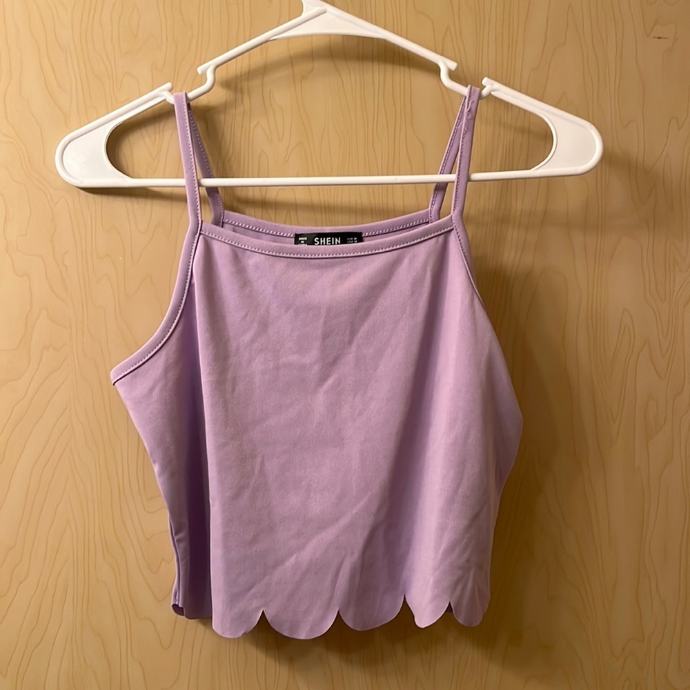 medium, light purple halter neck crop top, ruffle bottom.